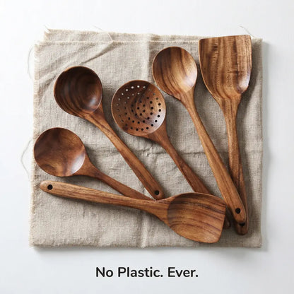 ForestCraft teak kitchen utensils laid out on burlap napkin - No Plastic Ever